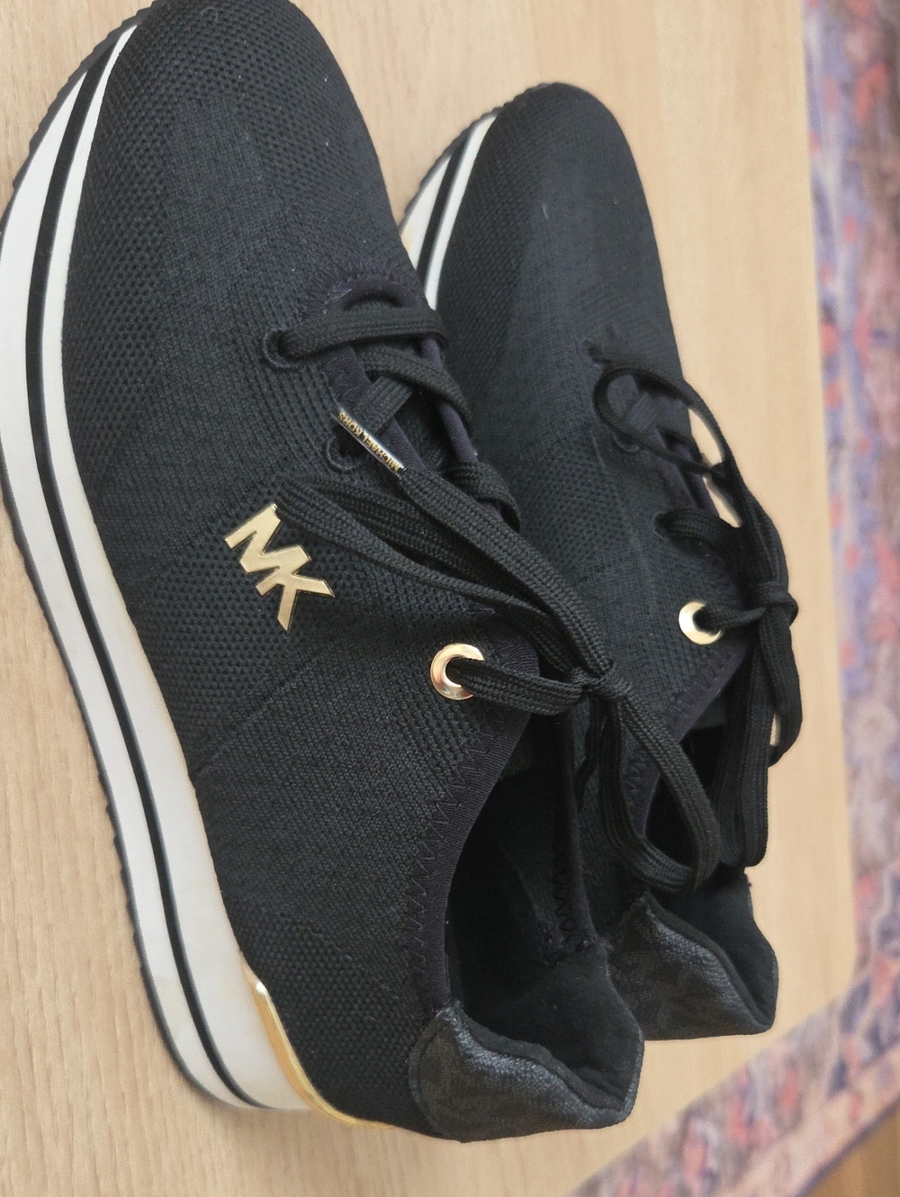 Michael Kors Black  Knit Sneakers with Gold Logo. Practically new only try on